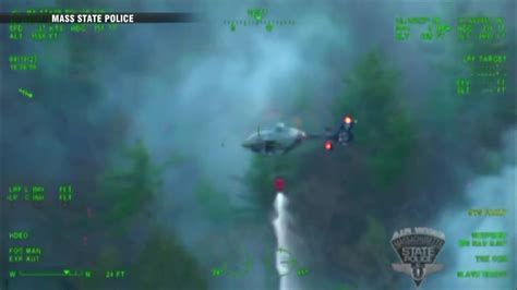 WATCH: Mass. State Police helicopter dumps water over Mt. Pisgah in Northboro to stop brush fire